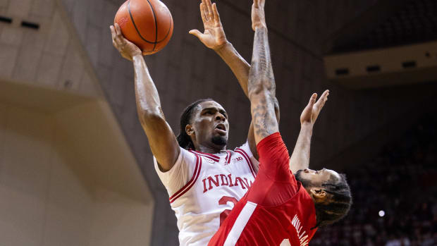 Indiana Hoosiers forward Mackenzie Mgbako (21) shoots the ball while Nebraska Cornhuskers guard Brice Williams (3) defends.